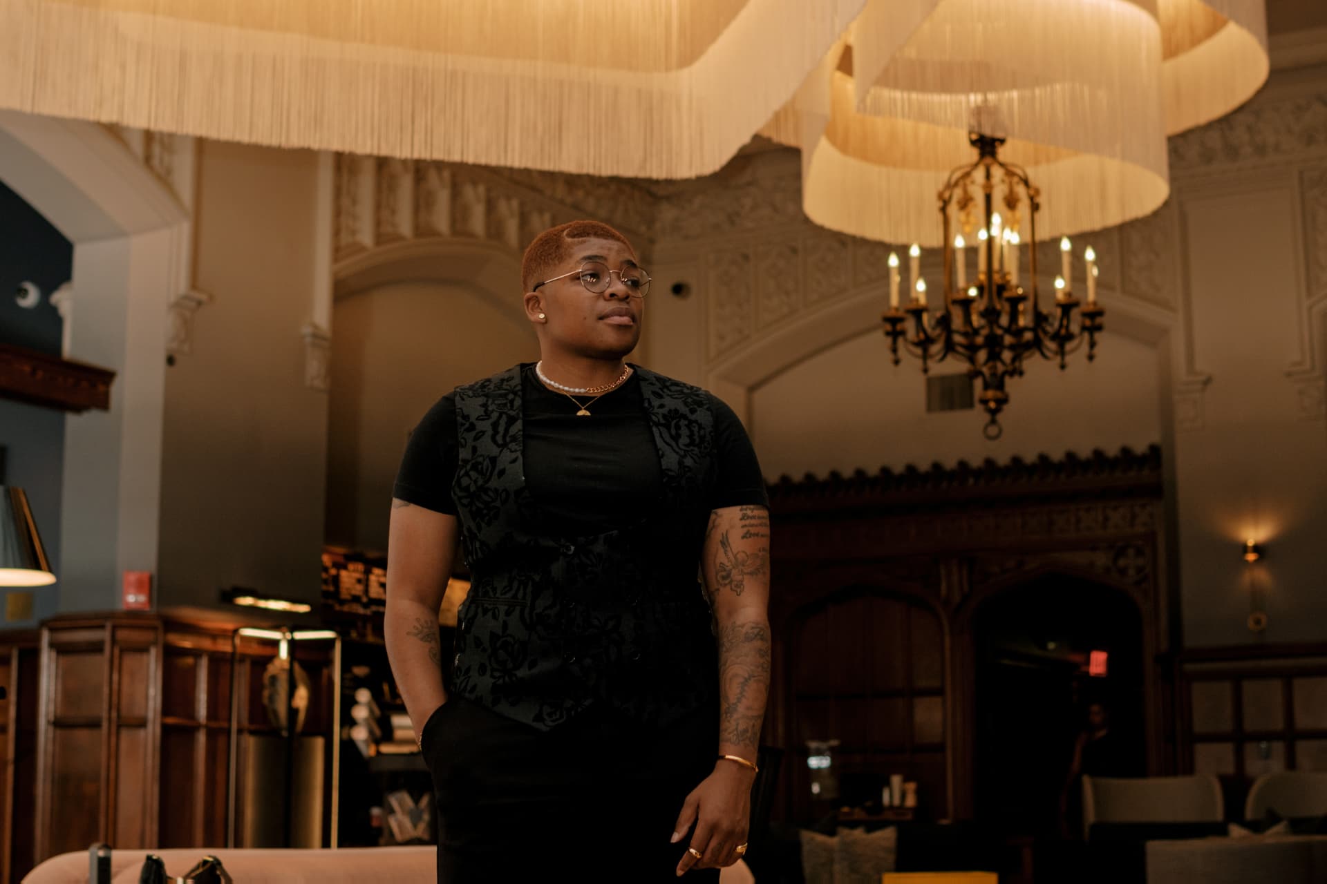 Jannae Gammage standing in a grand hotel lobby